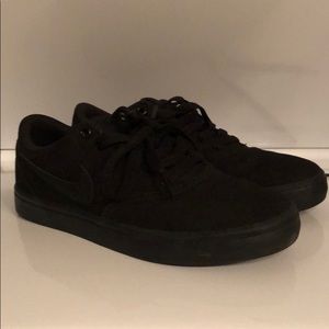All black Nike shoes